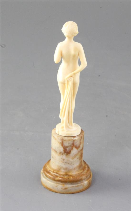 Joe Descamps. A 1930s carved ivory figure of a nude, height 5.75in.